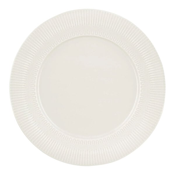 A white Schonwald porcelain plate with a circular pattern on the edge.