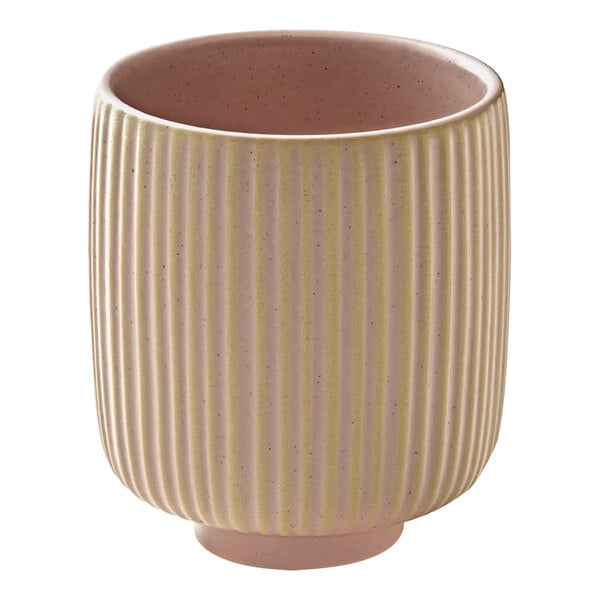 A close up of a Playground Nara rose cup with a striped pattern.