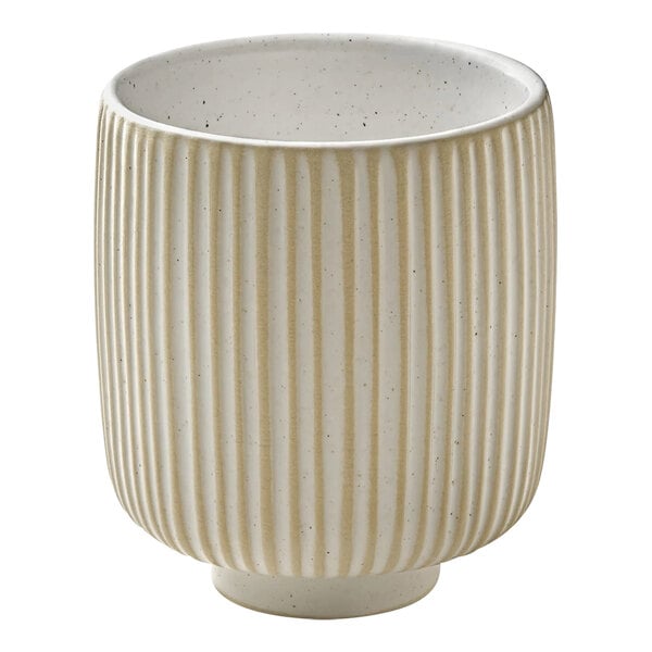 A white stoneware cup with tan stripes.