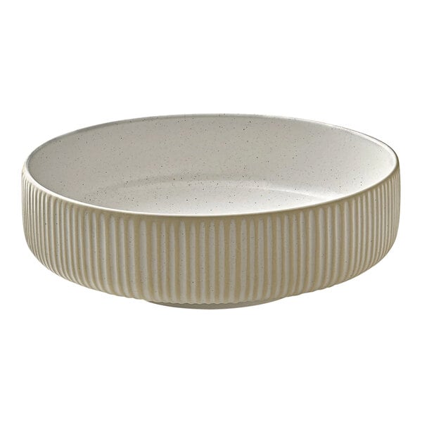 A white Playground Nara stoneware bowl with a striped design on the rim.