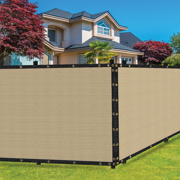 A beige SEALTECH privacy fence screen on a large fence.