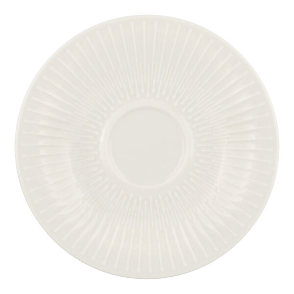 A Schonwald white porcelain saucer with a circular design.