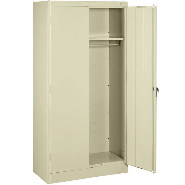 A beige Tennsco standard wardrobe cabinet with open solid doors.