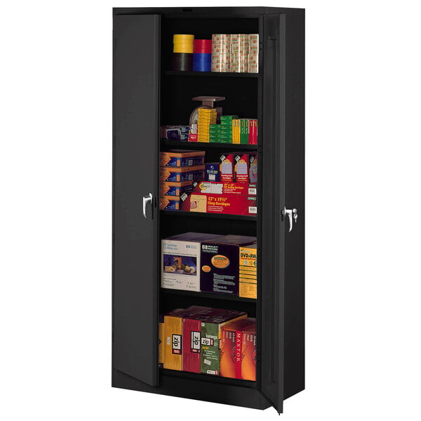 A black metal Tennsco storage cabinet with shelves full of boxes.