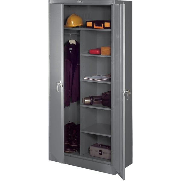 A grey metal Tennsco combination cabinet with solid doors.