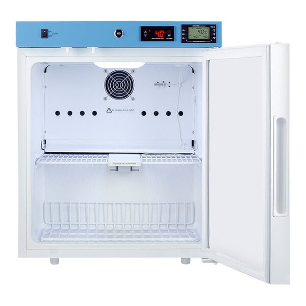 A Summit compact medical refrigerator with a white interior and a blue door.