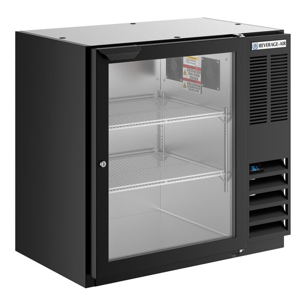A black underbar height glass door back bar refrigerator with two wire shelves and a front ventilation panel.