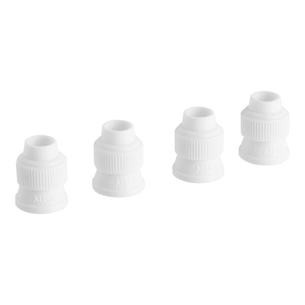 A group of white plastic fittings.