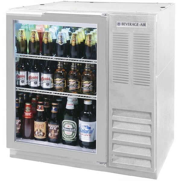 A Beverage-Air stainless steel back bar refrigerator filled with bottles of beer.
