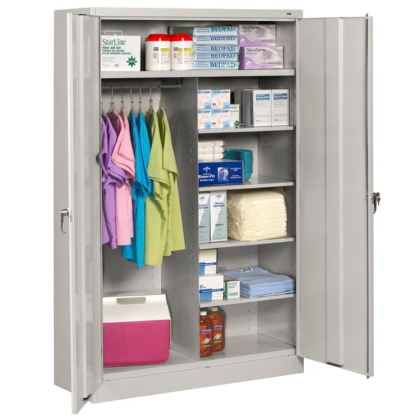 A light gray Tennsco jumbo combination cabinet with items on the shelves.