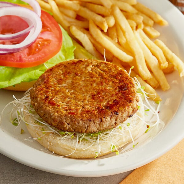 A Jack & Annie's vegan burger with lettuce and onion on a plate.