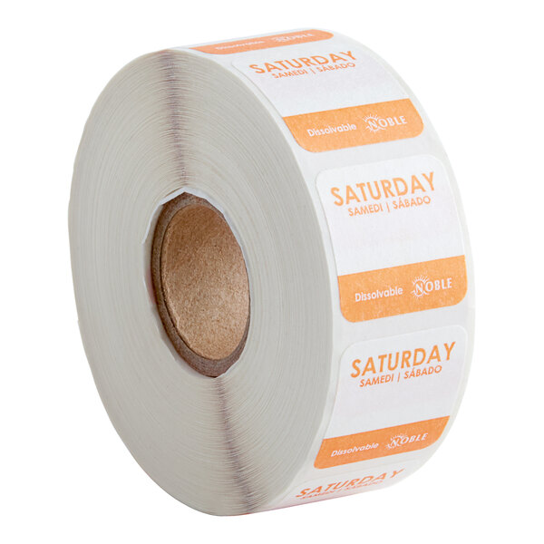 A roll of white and orange Noble Products Saturday labels.