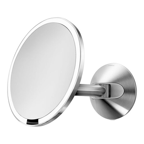 A simplehuman brushed stainless steel wall mounted mirror with a light on it.