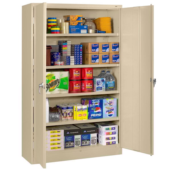 A Tennsco sand-colored jumbo storage cabinet with solid doors and a keyed lock.