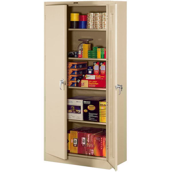 A sand-colored Tennsco metal storage cabinet with shelves full of items.