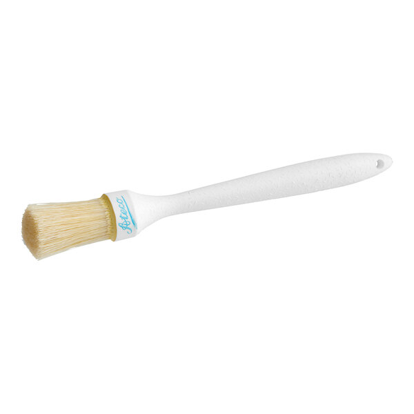A white round boar bristle pastry brush with a white plastic handle.