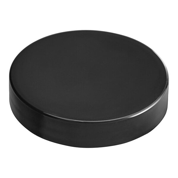 A black circular plastic lid with a white background.