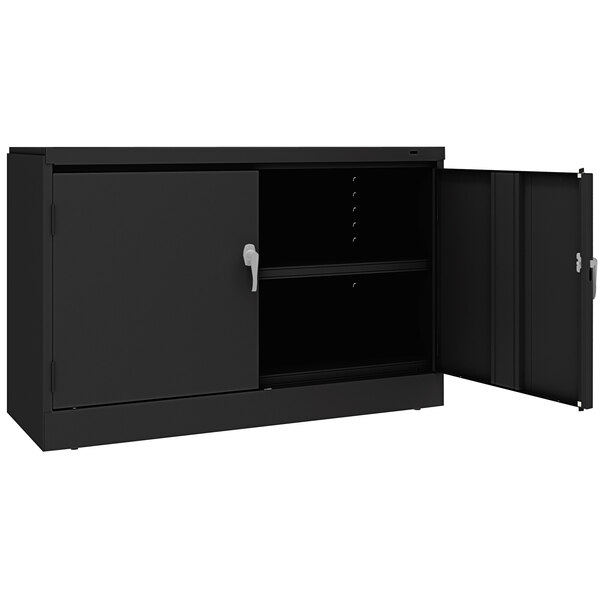 A black Tennsco storage cabinet with open doors.