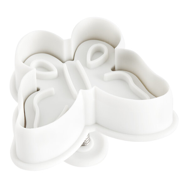 A white plastic Ateco butterfly plunger cutter.