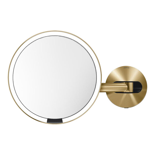 A round stainless steel wall-mounted mirror with a gold rim.