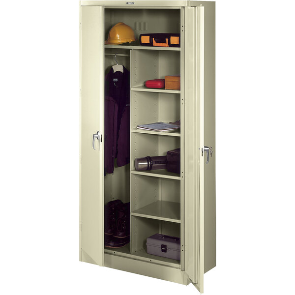A putty metal Tennsco combination cabinet with open solid doors.