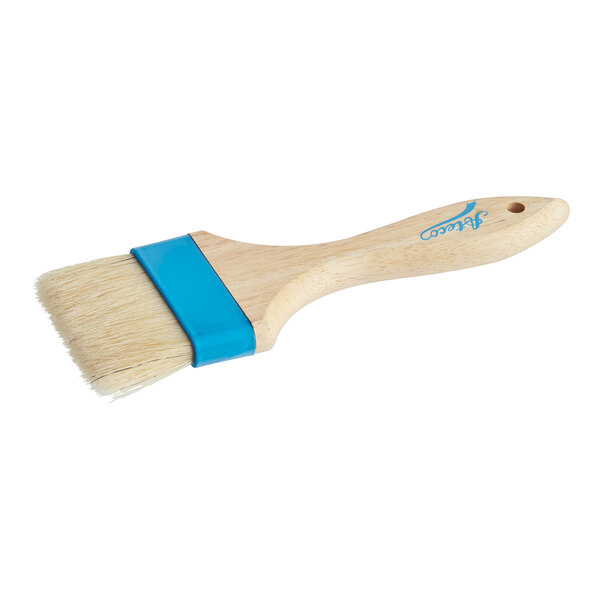 An Ateco baking and pastry brush with a wooden handle and blue bristles.