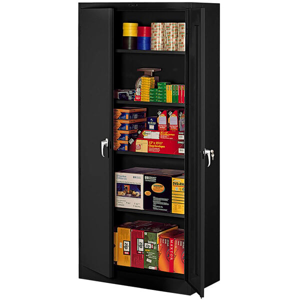 A black metal Tennsco storage cabinet with shelves full of boxes.