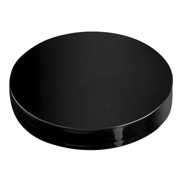 A black circular lid with a white background.