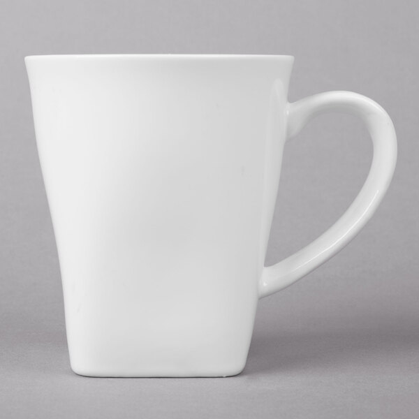 A close up of a 10 Strawberry Street Whittier white mug with a handle.