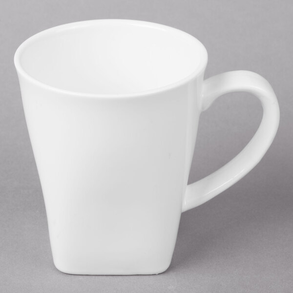 A white 10 Strawberry Street Whittier porcelain mug with a handle.