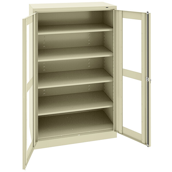 A white metal Tennsco storage cabinet with open doors.