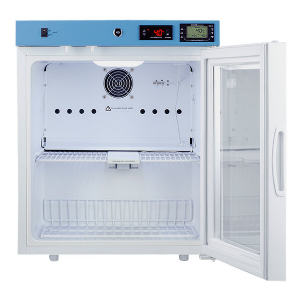 The inside of a Summit medical refrigerator with a white interior and a blue glass door.