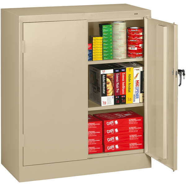 A Tennsco sand storage cabinet with solid doors open and shelves full of books.