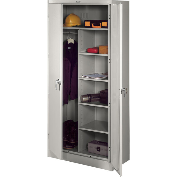 A light grey metal Tennsco storage cabinet with a door open.