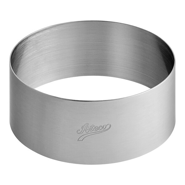 A silver stainless steel round cake ring with a logo on it.