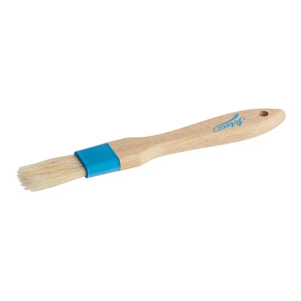 An Ateco basting and pastry brush with a wooden handle and blue bristles.