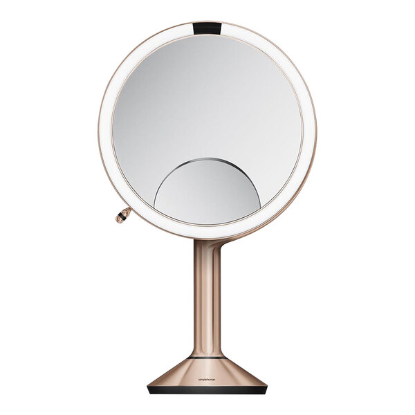 A circular mirror with a white base and stand.