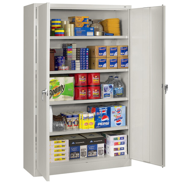 A light gray Tennsco jumbo storage cabinet with solid doors.