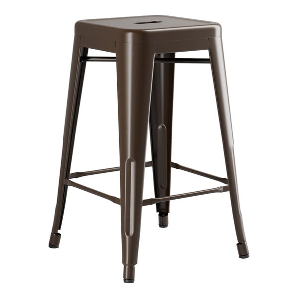 A brown metal Lancaster Table & Seating outdoor backless counter height stool with legs.