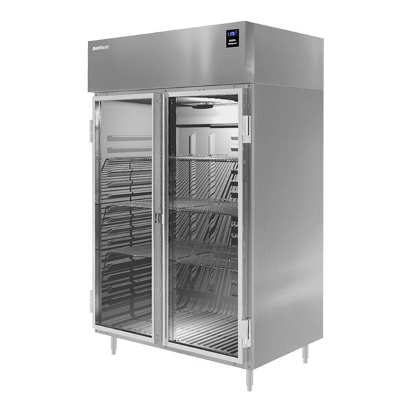 A Delfield reach-in refrigerator with glass doors on a metal shelf.