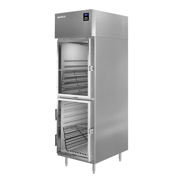 A stainless steel Delfield reach-in refrigerator with two half-height glass doors open.