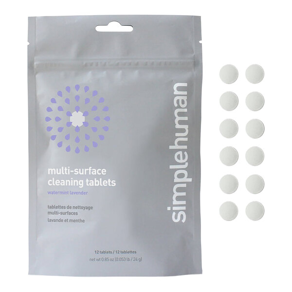 A white simplehuman package with white round multi-surface cleaning tablets and a logo with a white center and purple drops.