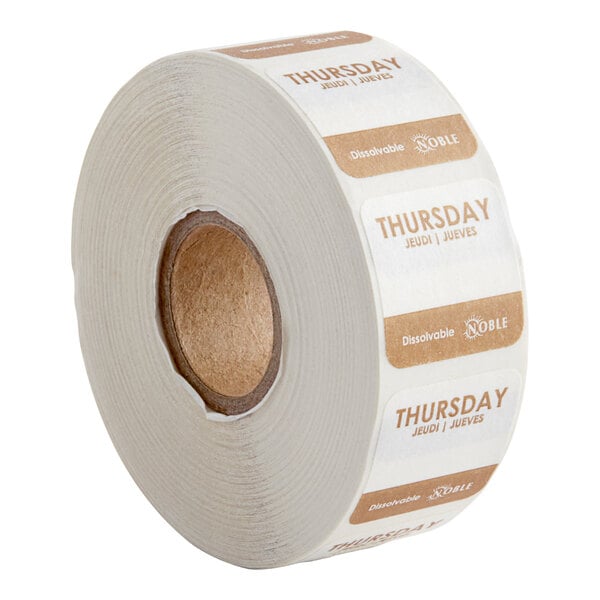 A roll of white paper with brown and white Noble Products Thursday labels.