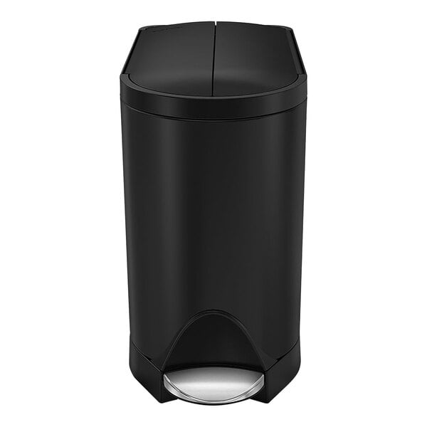 A matte black simplehuman rectangular butterfly step-on trash can with a lid.