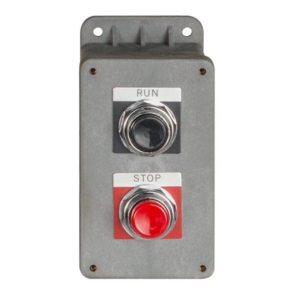 A grey metal panel with red and green buttons.