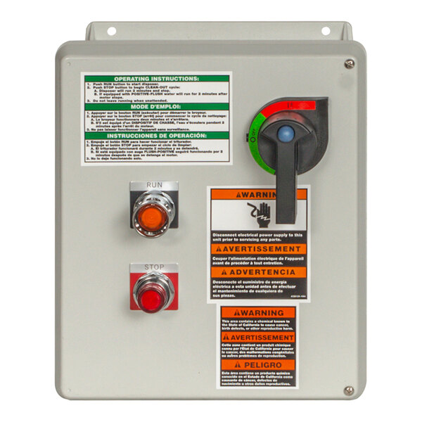 The red control panel for a Red Goat garbage disposal with two buttons and a red light.