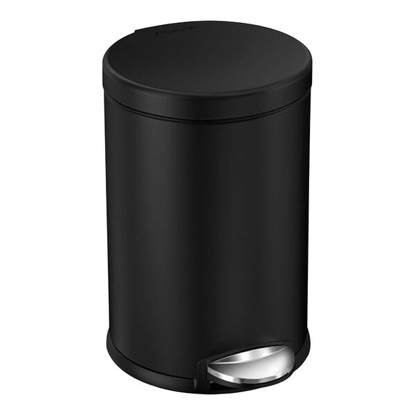 A simplehuman matte black stainless steel round step-on trash can with a lid.