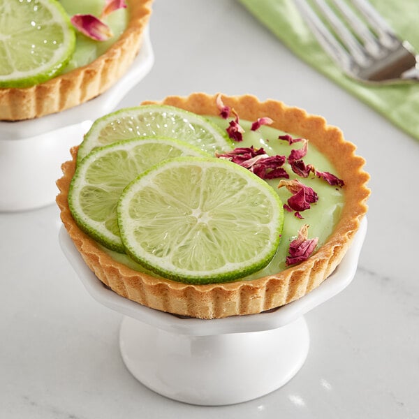 A lime pie with a slice of lime on top.