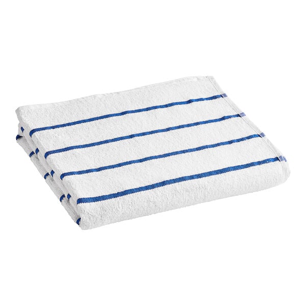 A folded white and blue striped Oxford pool towel.