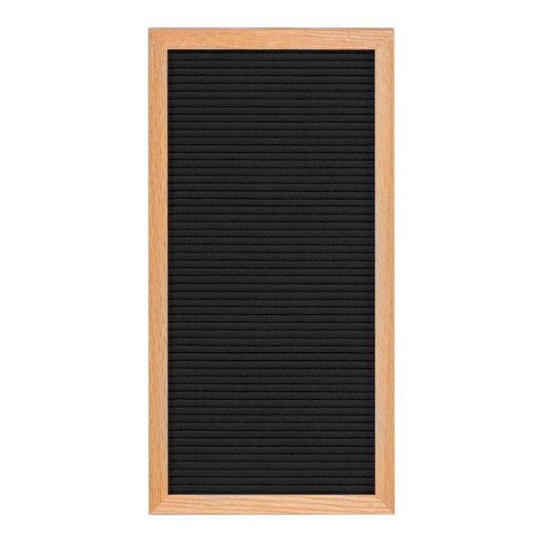 A black board with a light oak wood frame.